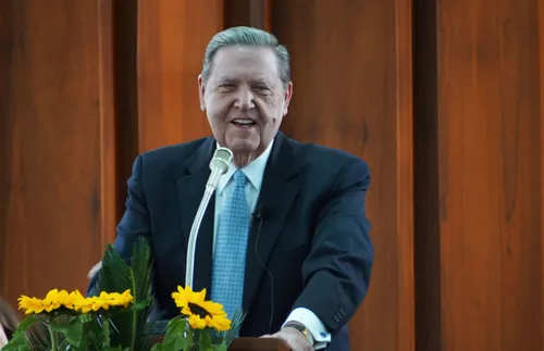 President Holland speaking in a meeting