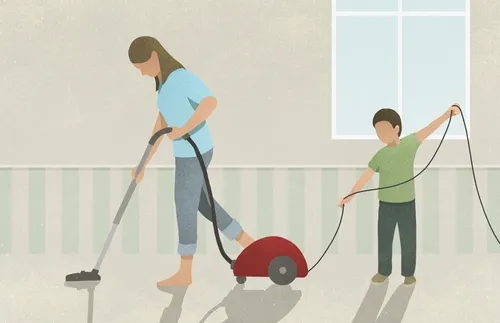 mother and son vacuuming