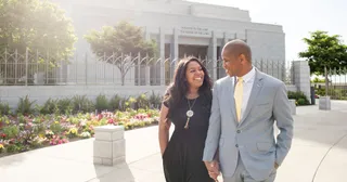 a couple holding hands at the temple