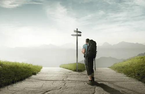 a man standing at a crossroads