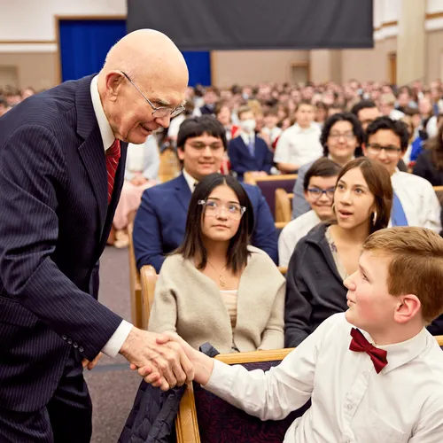Dallin H. Oaks with young people