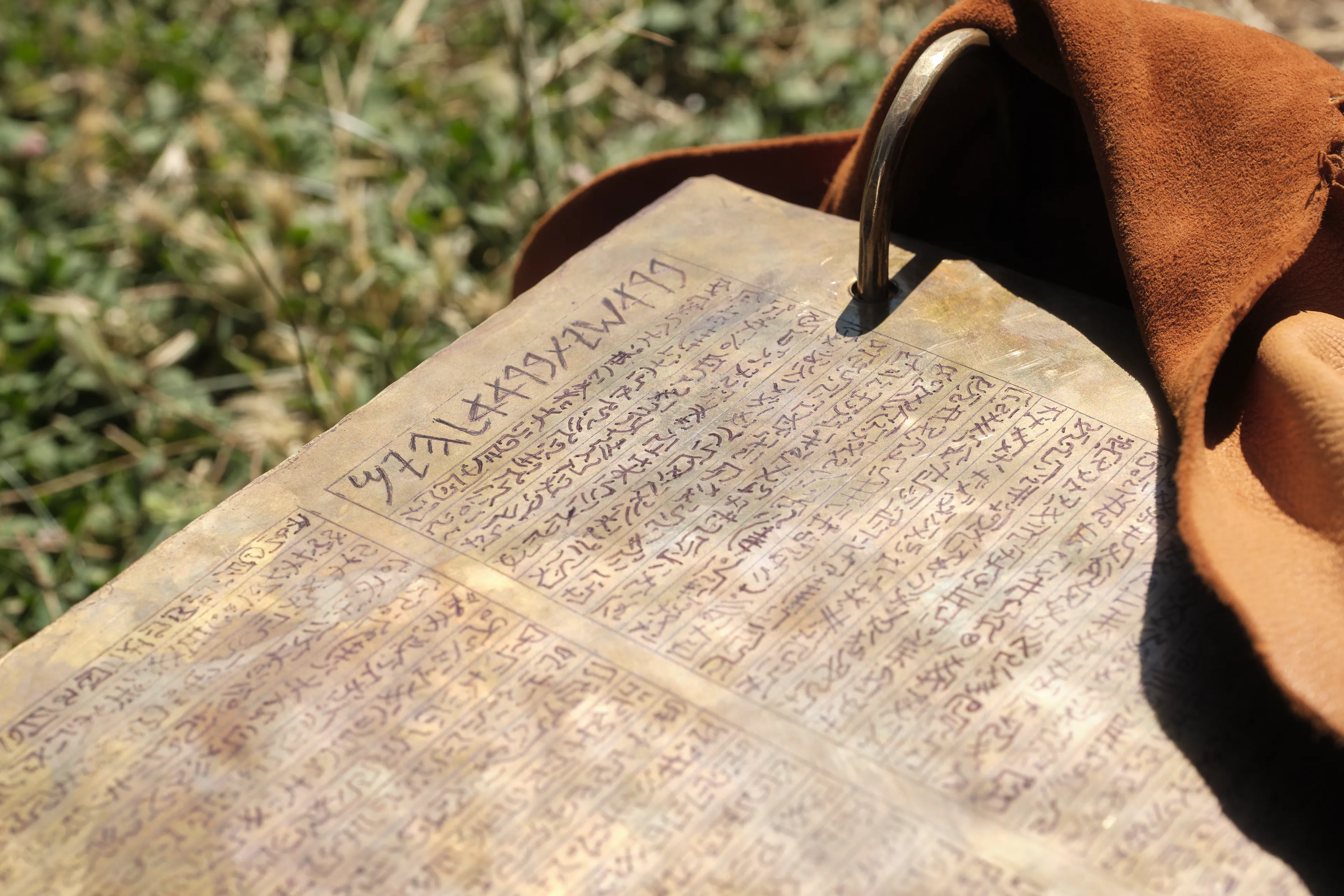 The brass plates lay upon the ground.