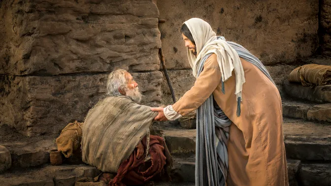 An elderly man sitting down by the pool of Bethesda while Christ stretches out His hand to heal him.