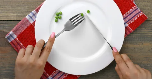 plate with a few peas on it