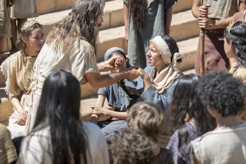 Jacob teaches the Nephites on the steps of the temple.