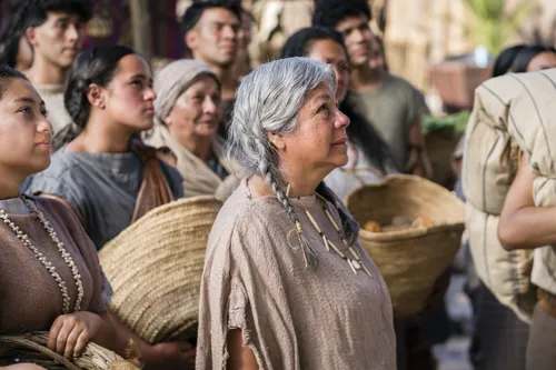 A woman listens as Alma the Younger preaches to the people of Gideon.