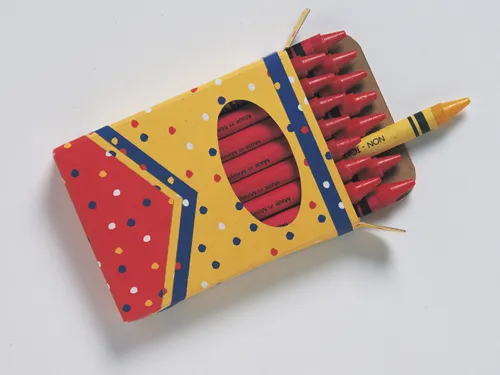 box of red crayons with one yellow