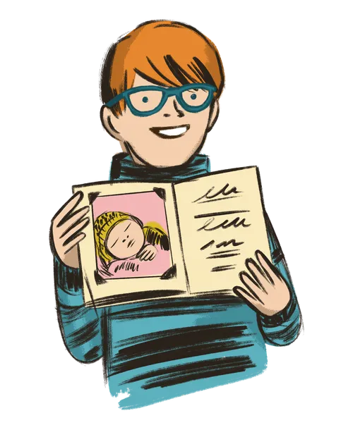 Boy holding up baby book