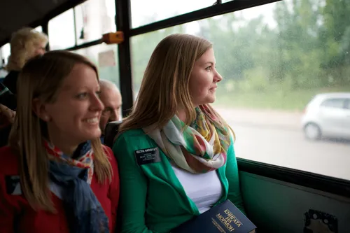 sister missionaries riding a bus