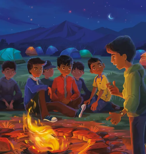 boys sitting around campfire at night