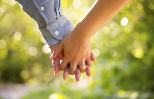 a couple holding hands