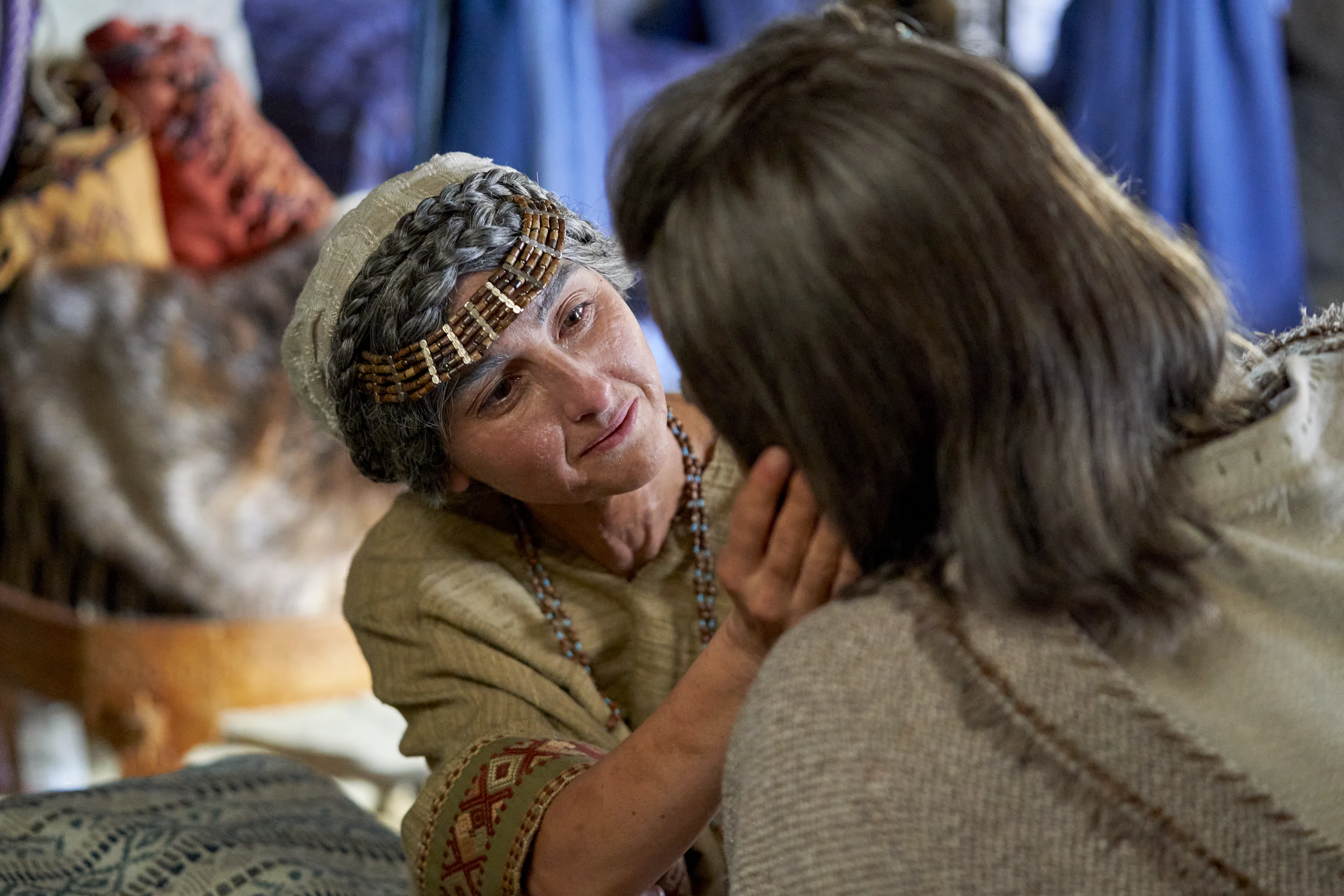 The wife of Alma the Elder sits and talks with her husband.