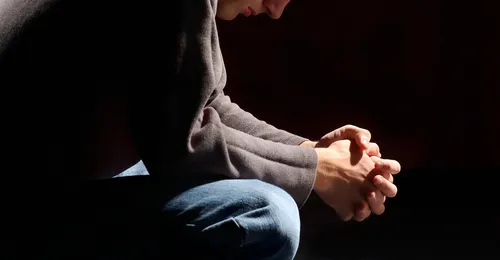 young man praying