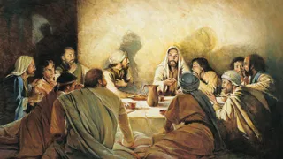 Jesus Christ seated at a table with His apostles. The apostles are watching Christ as He breaks bread and offers it to them in remembrance of His body and blood. The painting depicts the institution of the Sacrament at the Last Supper.