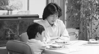 mother and son blessing eating