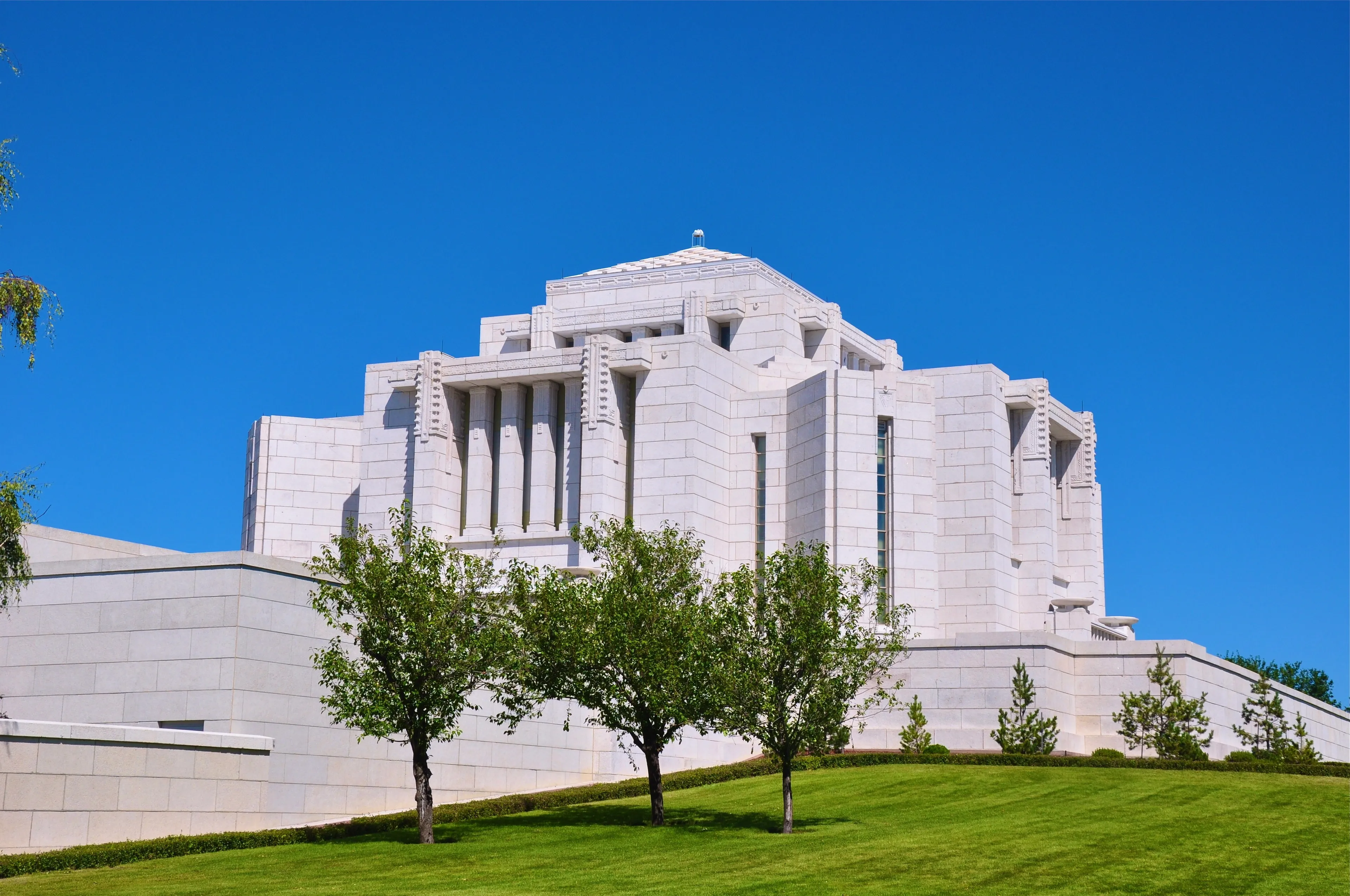 A side view of the Cardston Alberta Temple, including scenery.