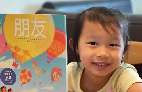 girl holding Friend magazine