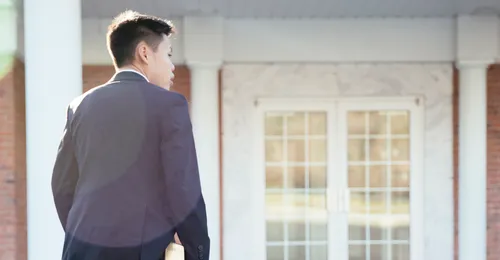 young man walking up to chapel