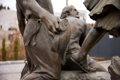 A view of Temple Square while under construction in December 2024. The image features a close-up view of a fish on the newly installed Come Follow Me Statue at the northwest quadrant.