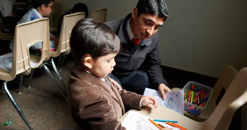 child coloring in church classroom