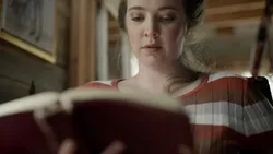 A young woman reading the Holy Bible