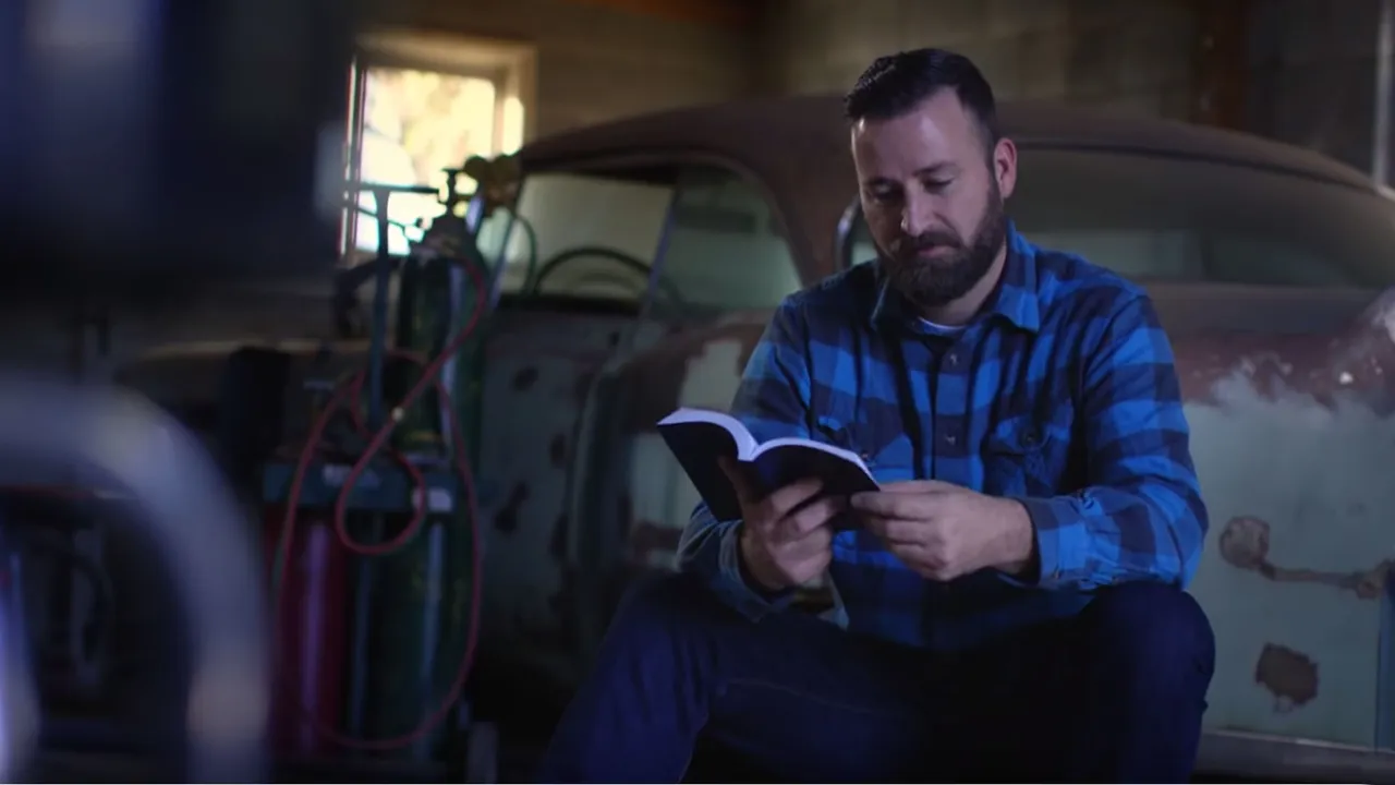 Jared stands in front of a vintage car discussing the blessings of the gospel of Jesus Christ