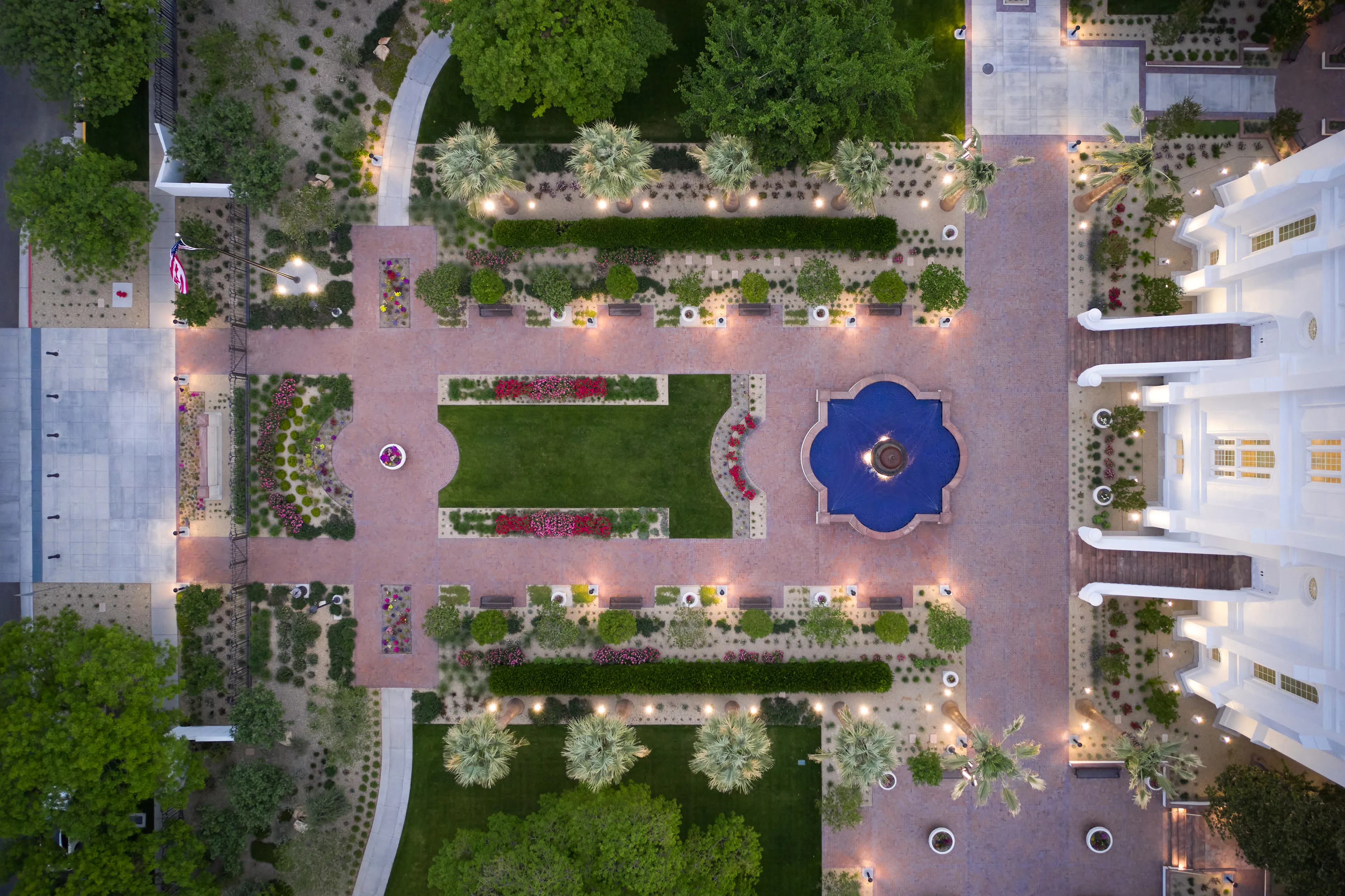 Exterior image of the St. George Utah Temple. The image is a drone shot (birds eye view image) showing the gardens leading to the front door of the temple. 