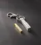 Children and Youth oil vial for Young Men. Vial lays on a dark background. Image features the vial and key chain in both gold and silver.