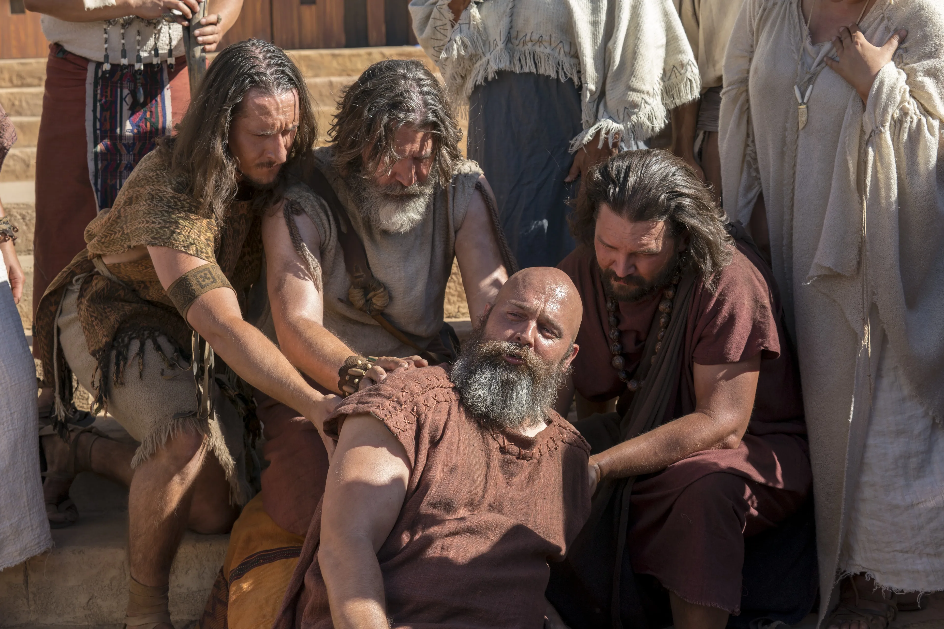 Nephites carry Sherem after he was struck down as a sign from God.