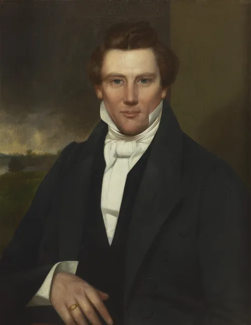 Bust portrait of Joseph Smith. He is depicted wearing a dark suit, white shirt with a high collar and white tie.