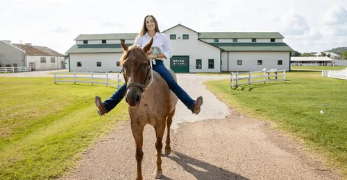 young woman on a horse