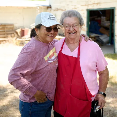two women standing outside