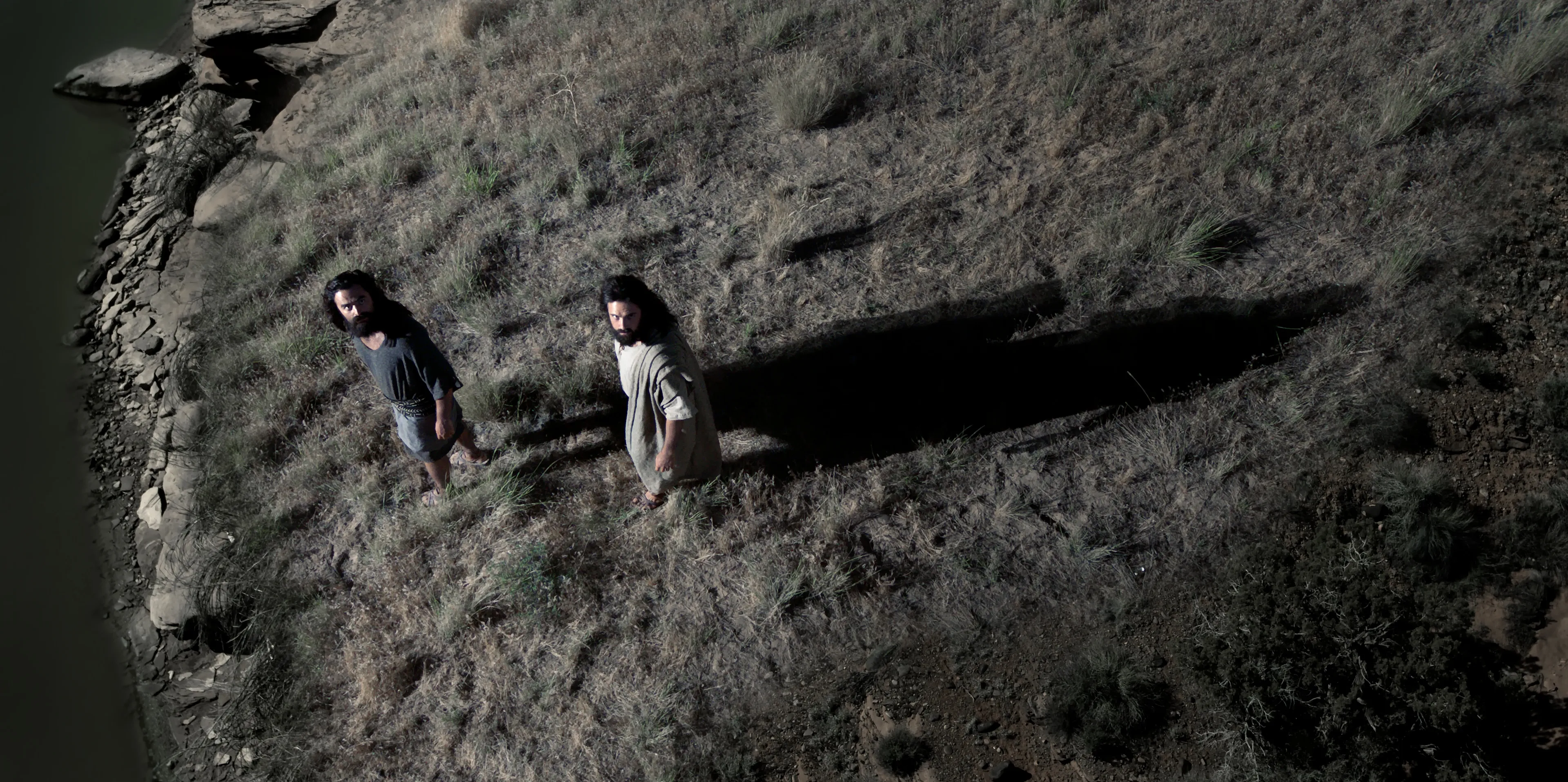 Laman and Lemuel look back at Lehi in his vision of the tree of life.