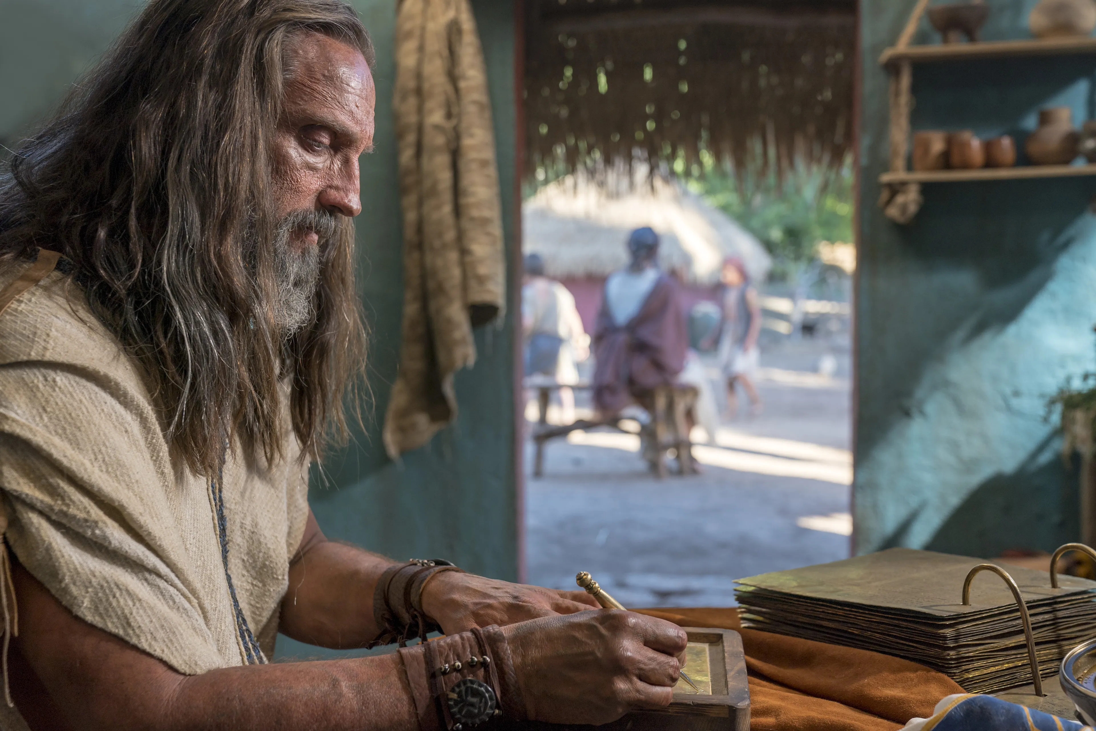 Nephi records his testimony on metal plates.