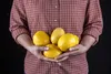 person holding lemons