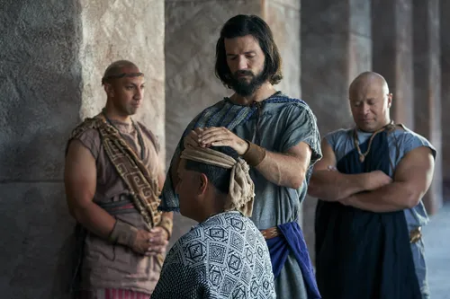 Alma the Younger blesses a man with the laying on of hands in the city of Zarahemla.