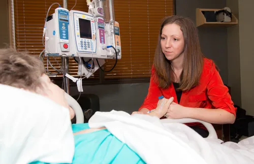 woman visiting another woman in the hospital