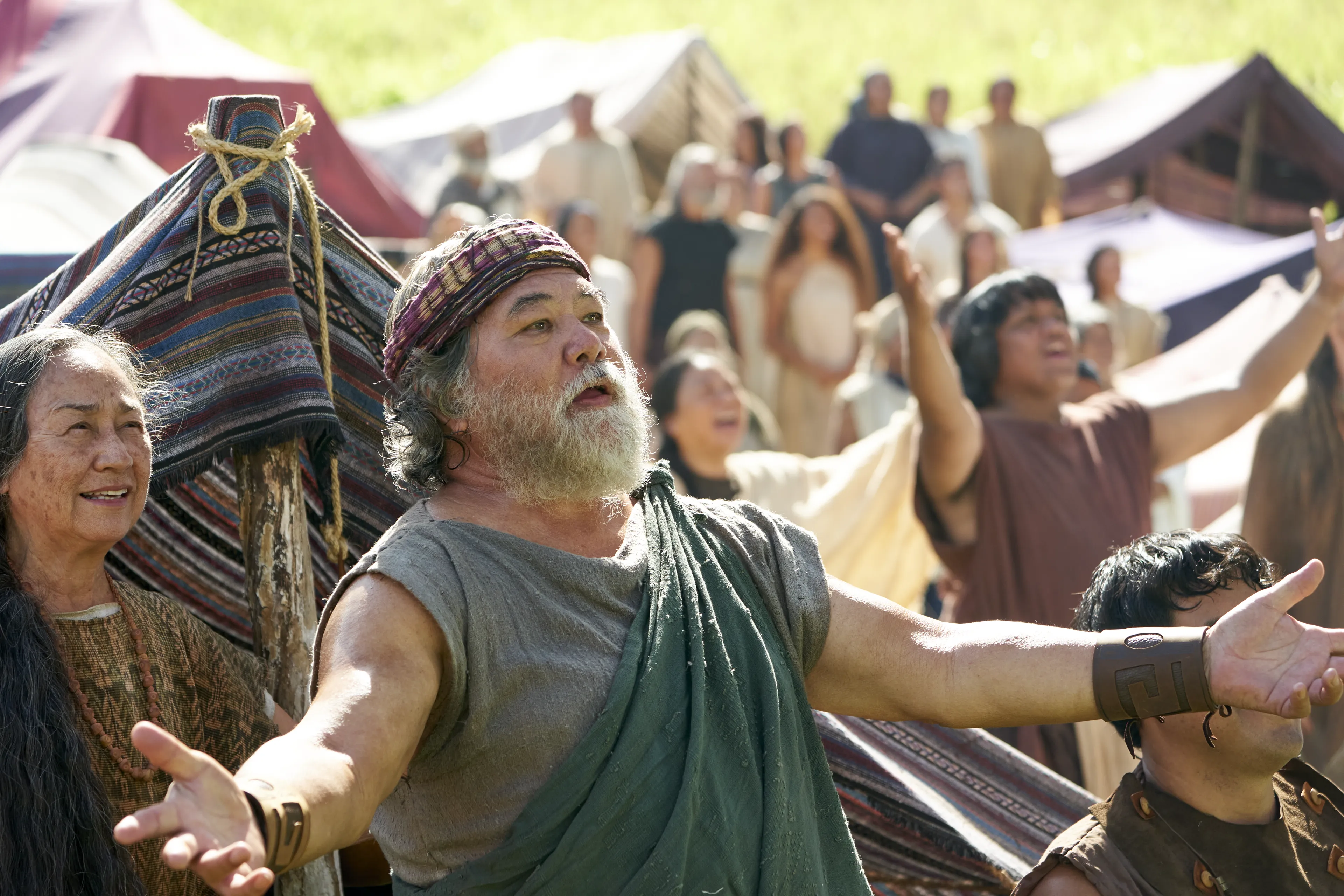 Men and women gather to listen to King Benjamin in the Land of Zarahemla.