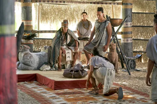 A closed bag, containing the arms of the Lamanites, is presented to King Lamoni by his servants in the land of Ishmael.