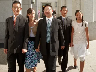family walking out of building