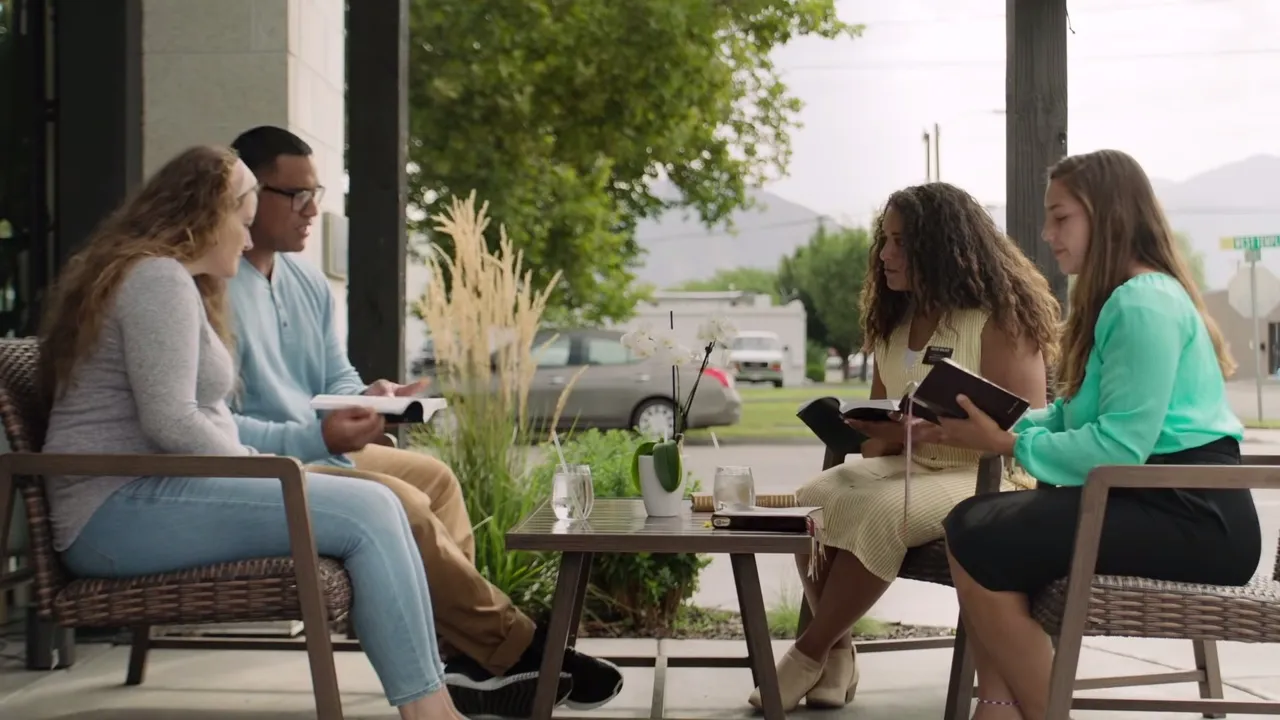 Latter-day Saint missionaries teaching about the scriptures