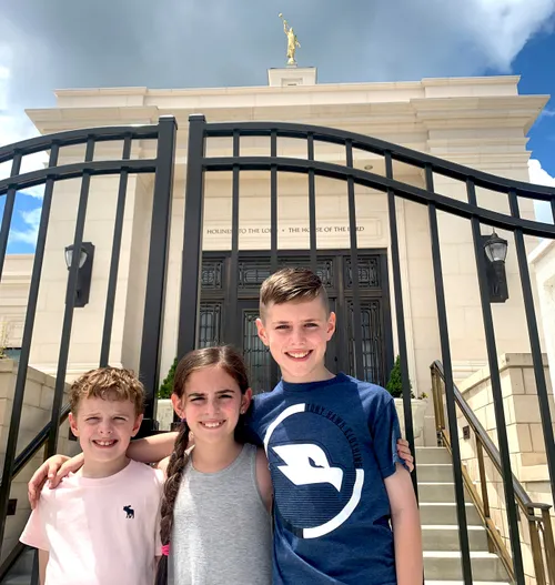 siblings outside temple gates