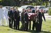 grandsons carrying casket