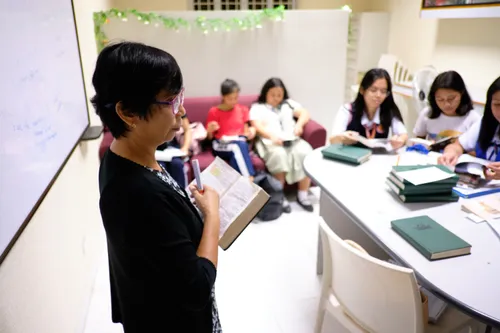 woman teaching students