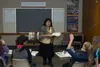 woman teaching students in classroom