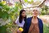 grandmother and granddaughter walking outside