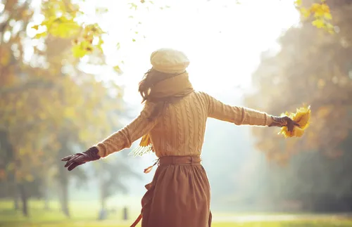 Woman with arms outstretched