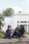 mother and daughter in front of temple