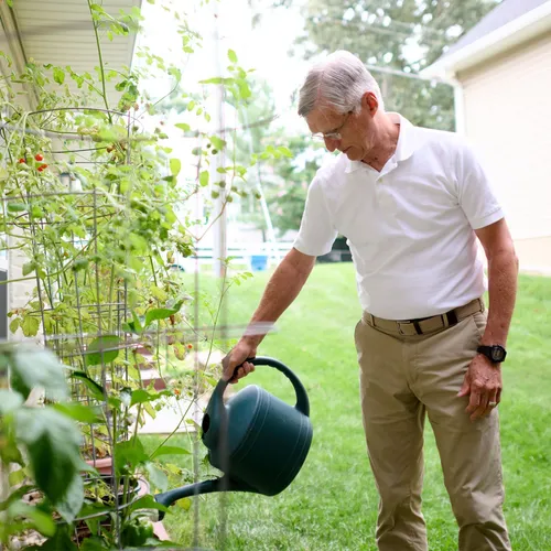 man watering plants