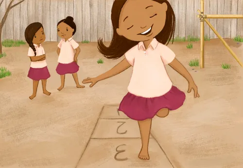 girl playing hopscotch outside